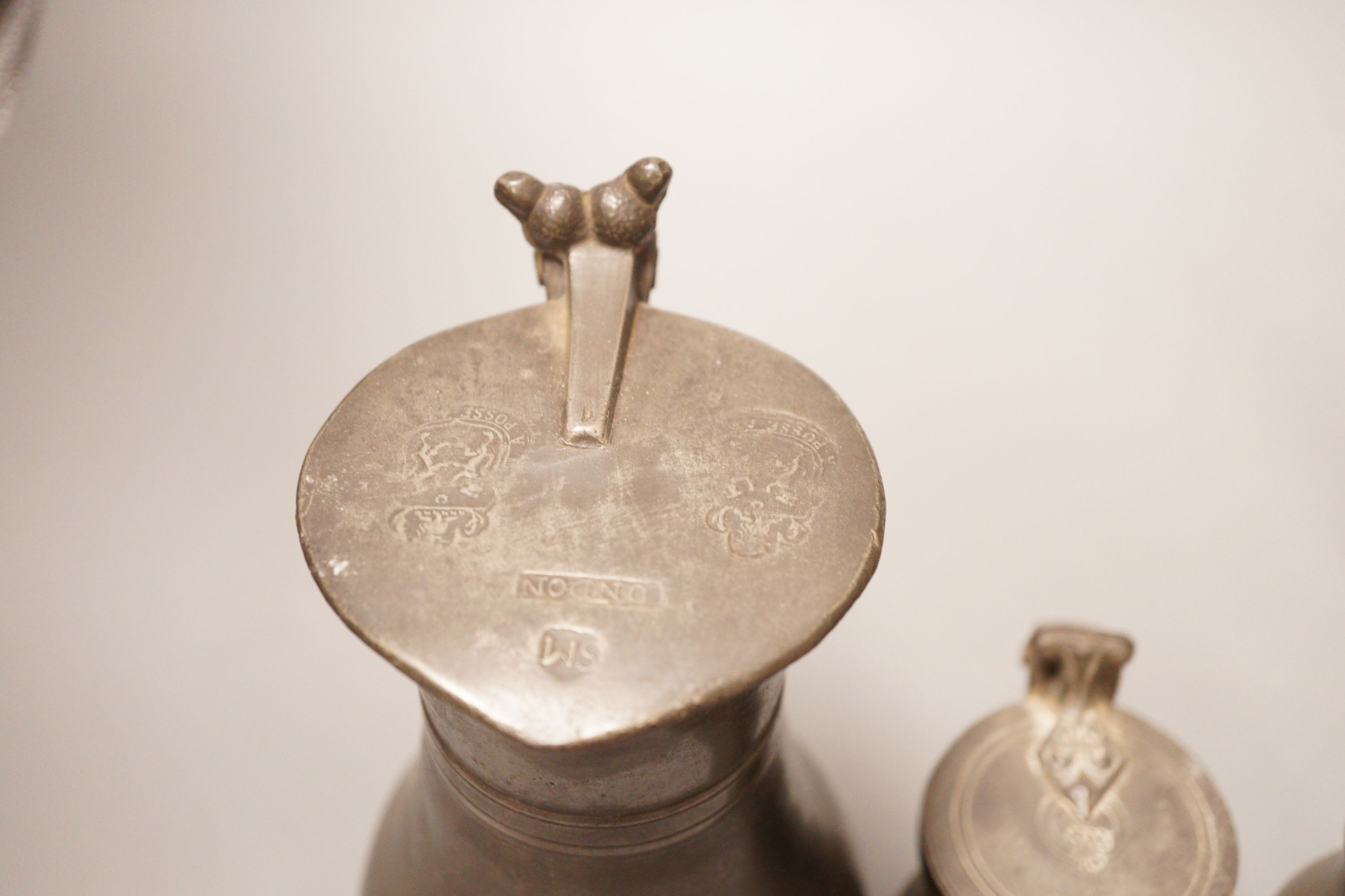 A group of 18th / 19th century pewter measures, 19cm